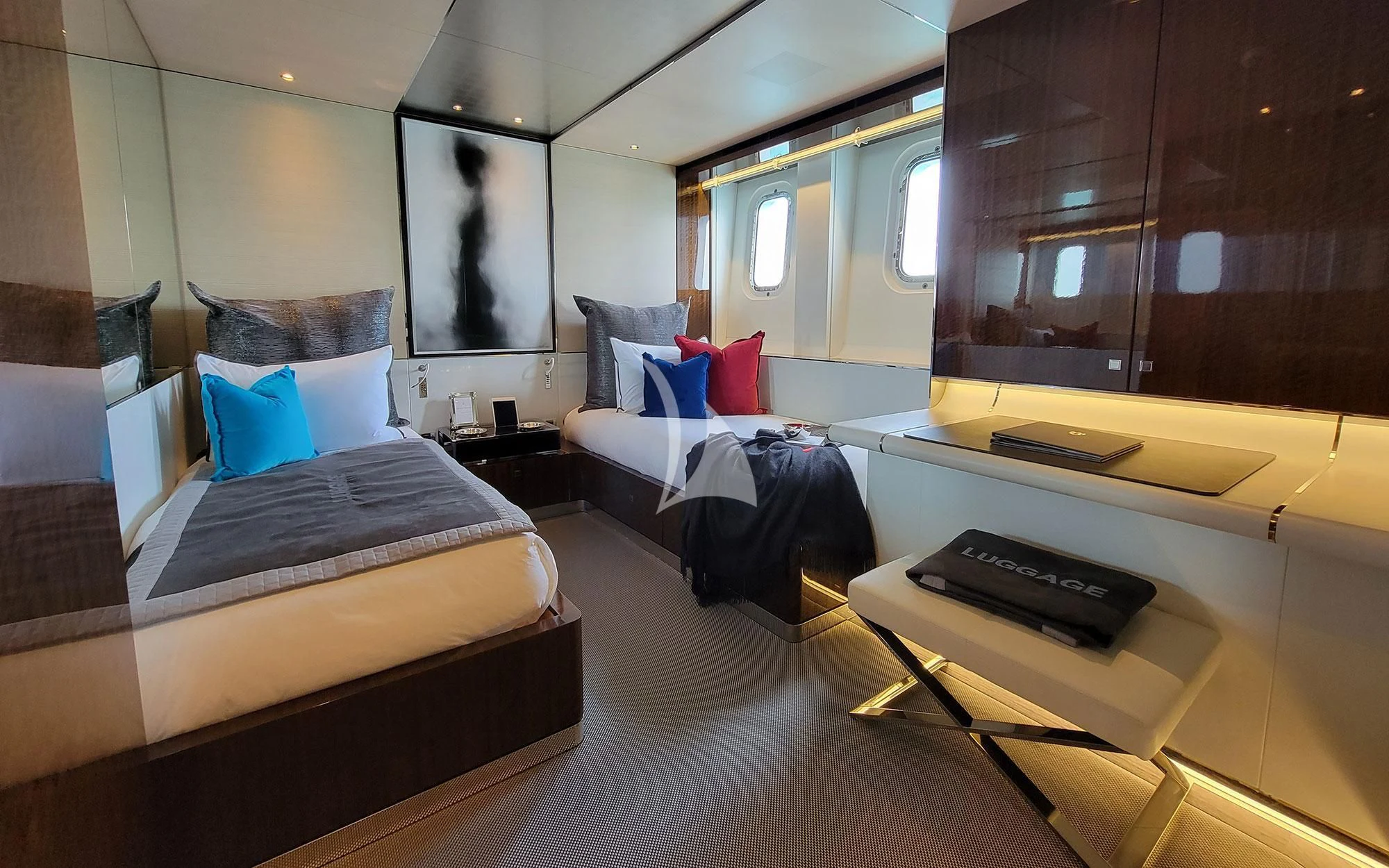 a room with a bed and desk aboard KNIGHT Yacht for Charter