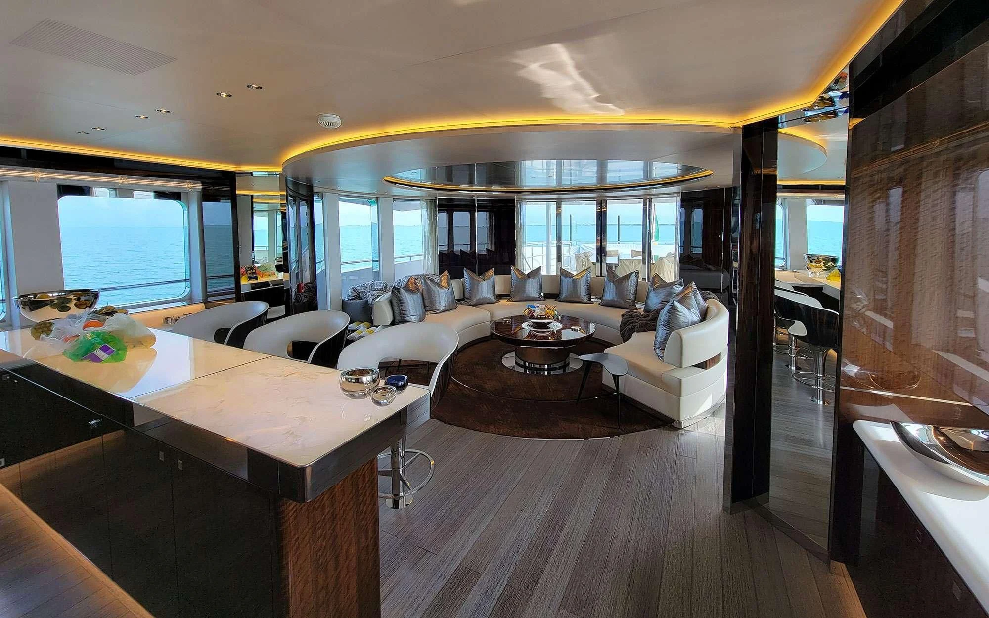 a living room with a large window aboard KNIGHT Yacht for Charter