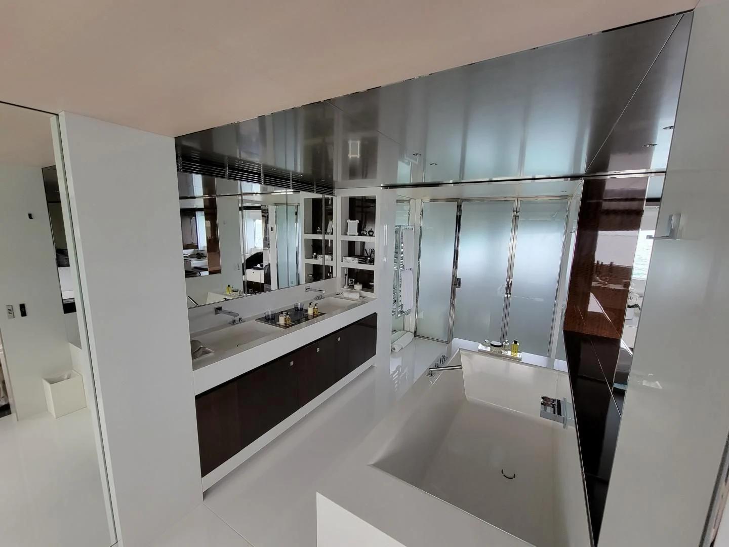 a bathroom with a large mirror aboard KNIGHT Yacht for Charter