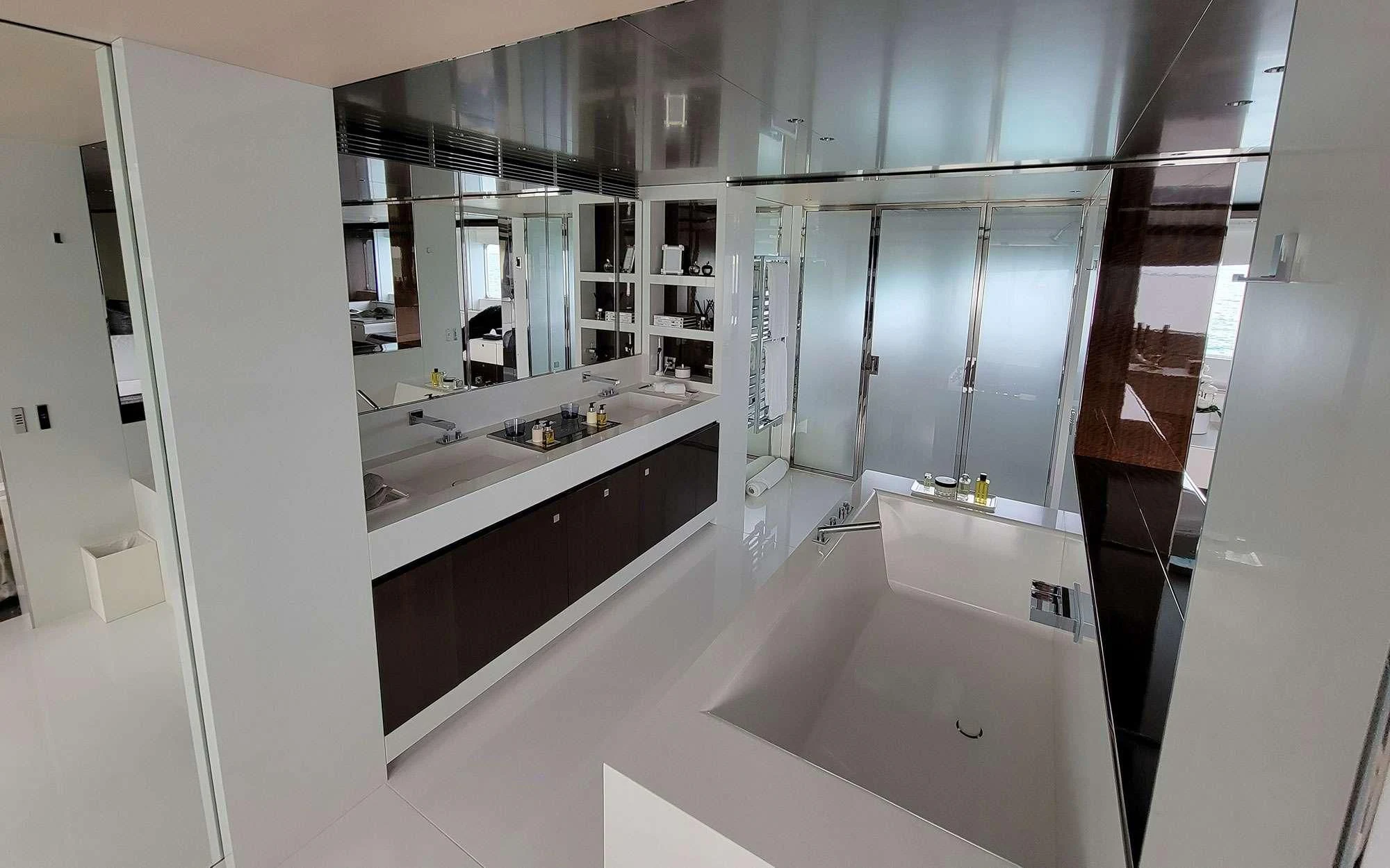 a bathroom with a large mirror aboard KNIGHT Yacht for Charter