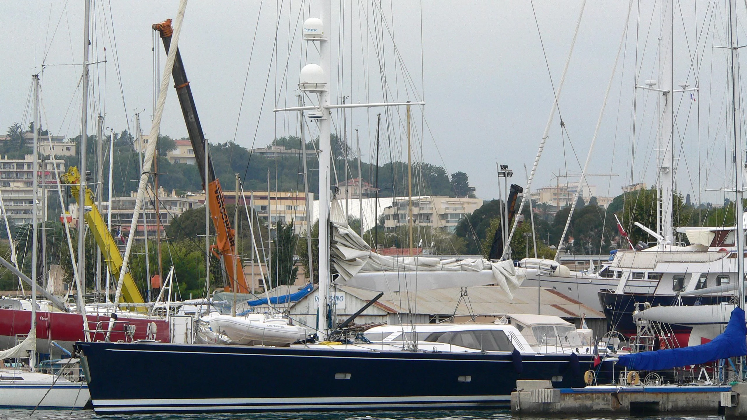 a group of boats are parked in a harbor aboard VAIMITI Yacht for Sale