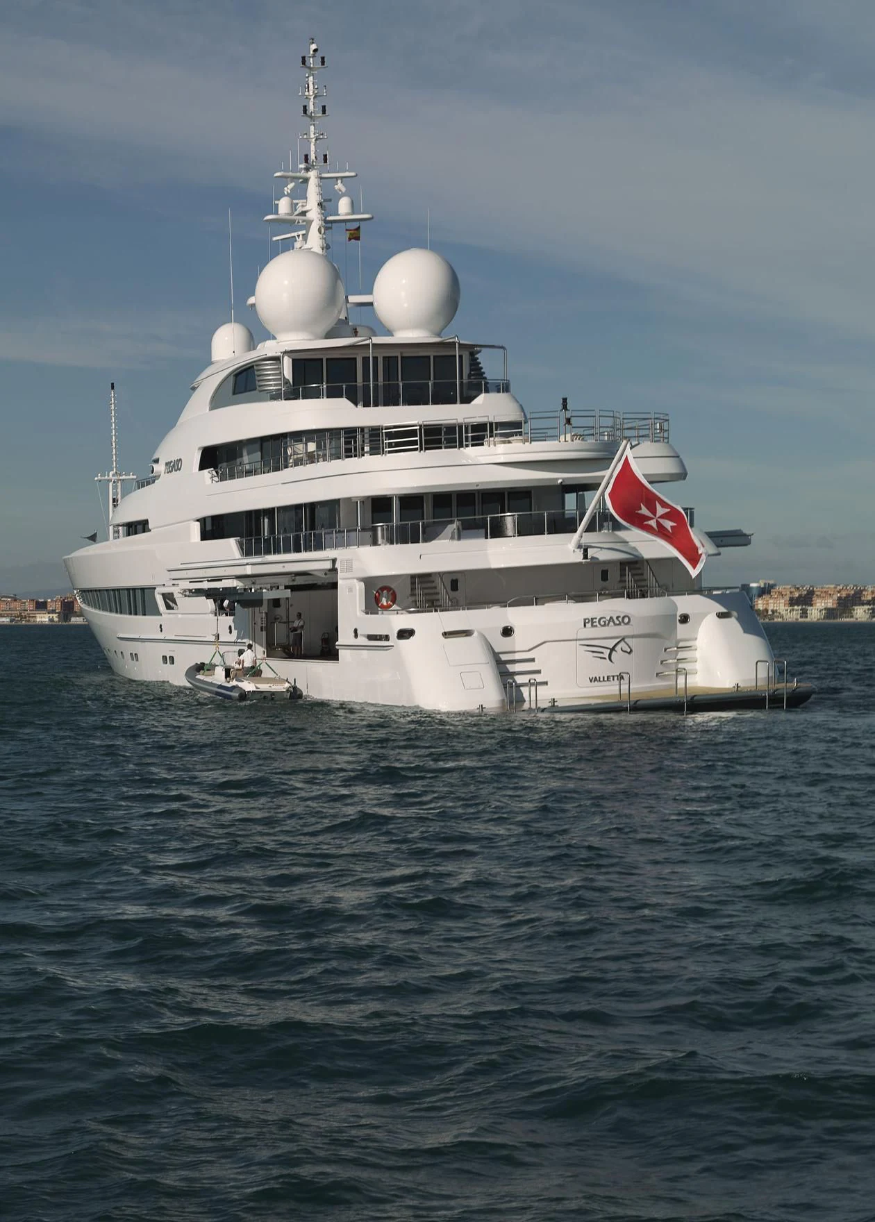 a large white ship in the water aboard NAIA Yacht for Sale