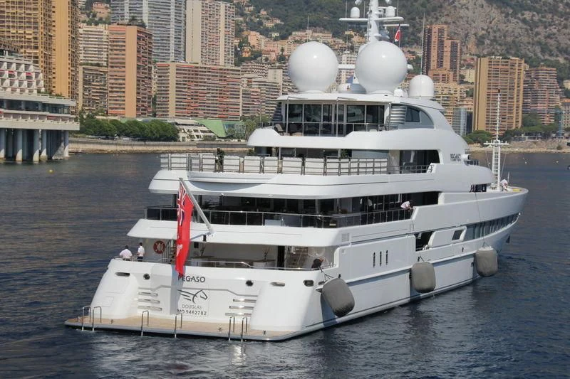 a white boat on the water aboard NAIA Yacht for Sale