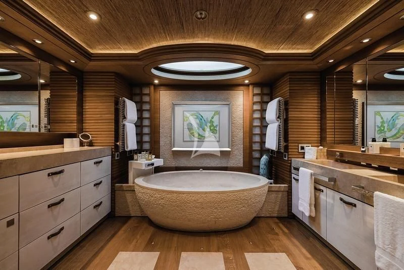 a bathroom with a large bathtub aboard NAIA Yacht for Sale