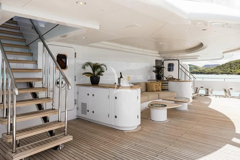 a white kitchen with a ladder aboard NAIA Yacht for Sale