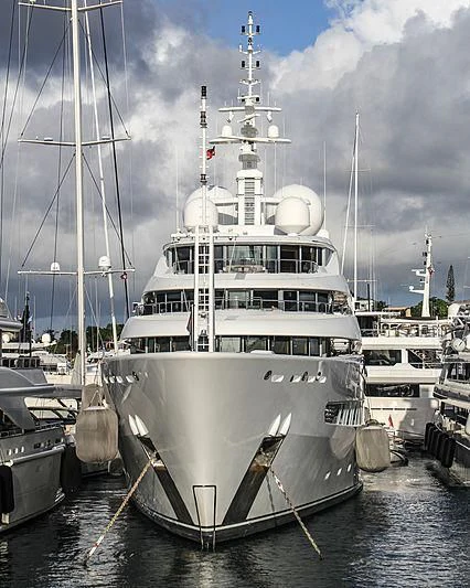a large white boat in the water aboard NAIA Yacht for Sale