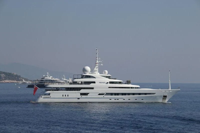 a large white ship in the water aboard NAIA Yacht for Sale