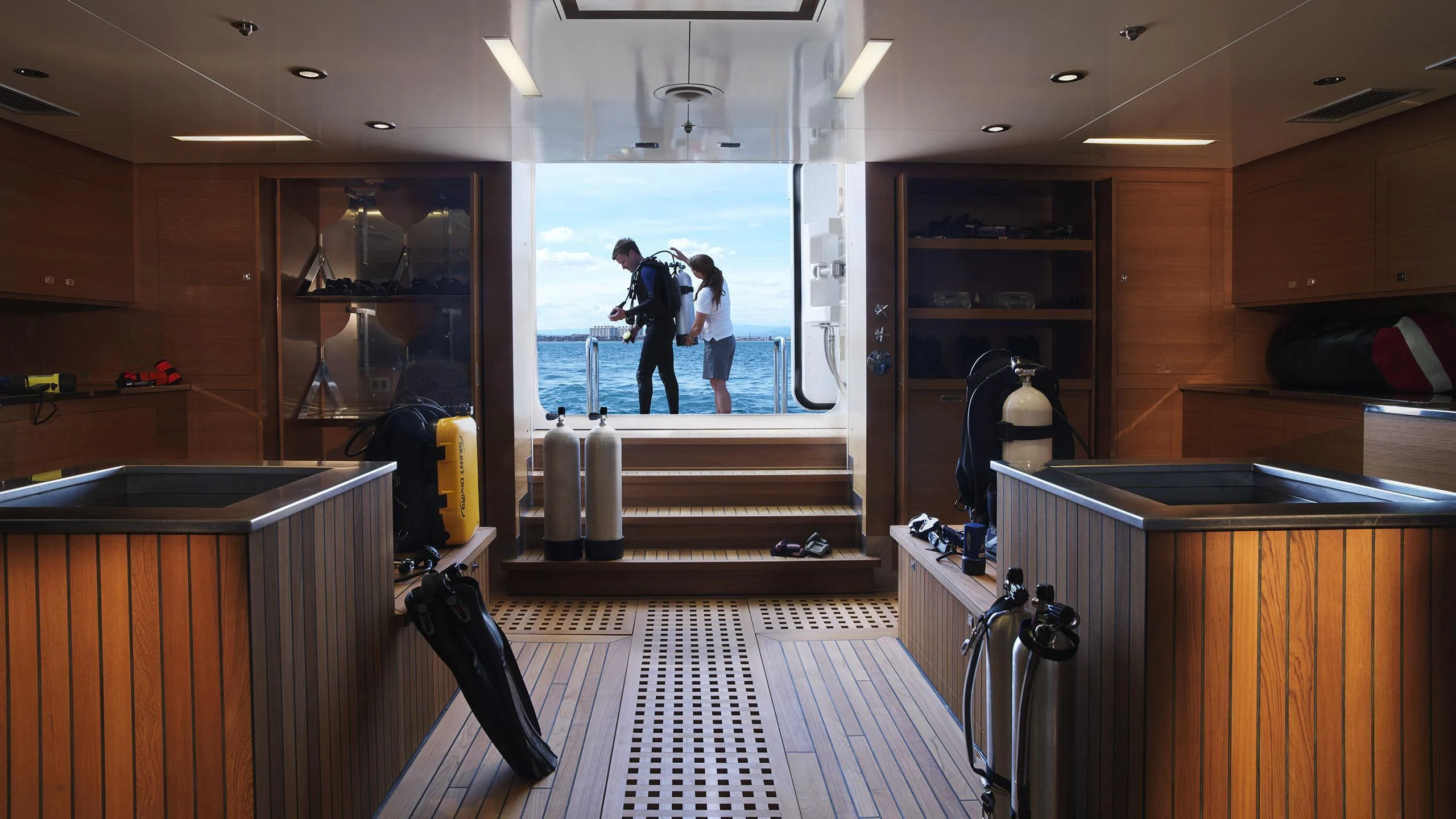 a couple of people in a room aboard NAIA Yacht for Sale