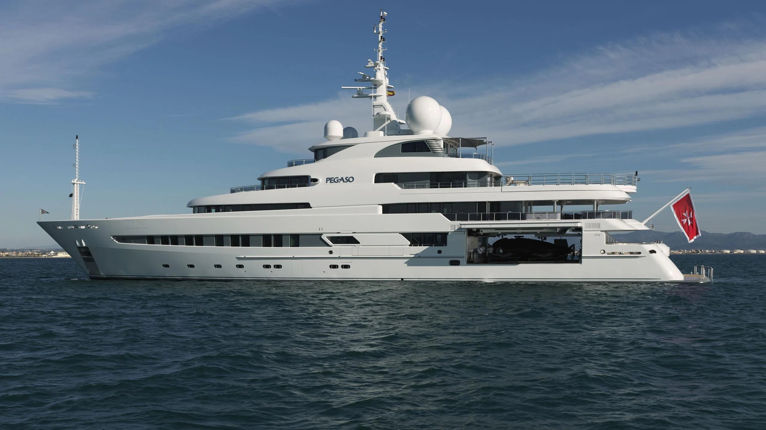 a large white ship in the water aboard NAIA Yacht for Sale