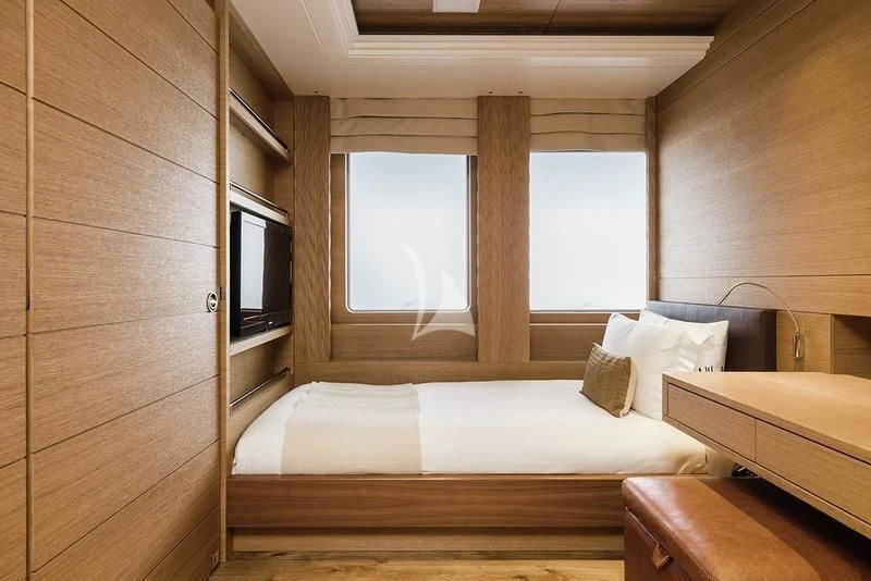 a room with two beds aboard NAIA Yacht for Sale