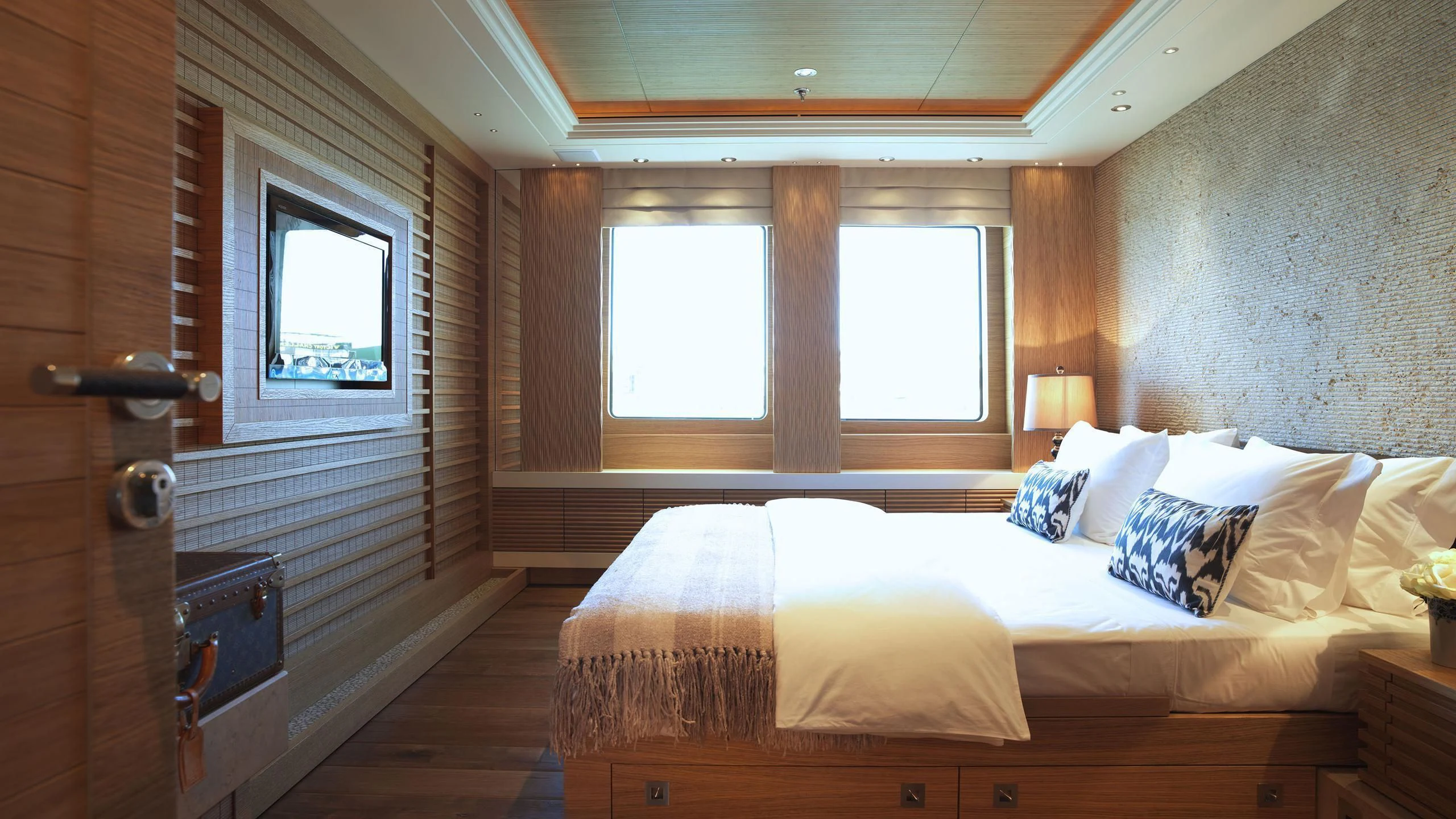 a bed in a room aboard NAIA Yacht for Sale