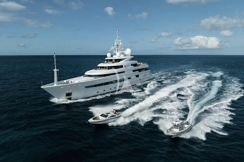 a large white ship on the water aboard NAIA Yacht for Sale