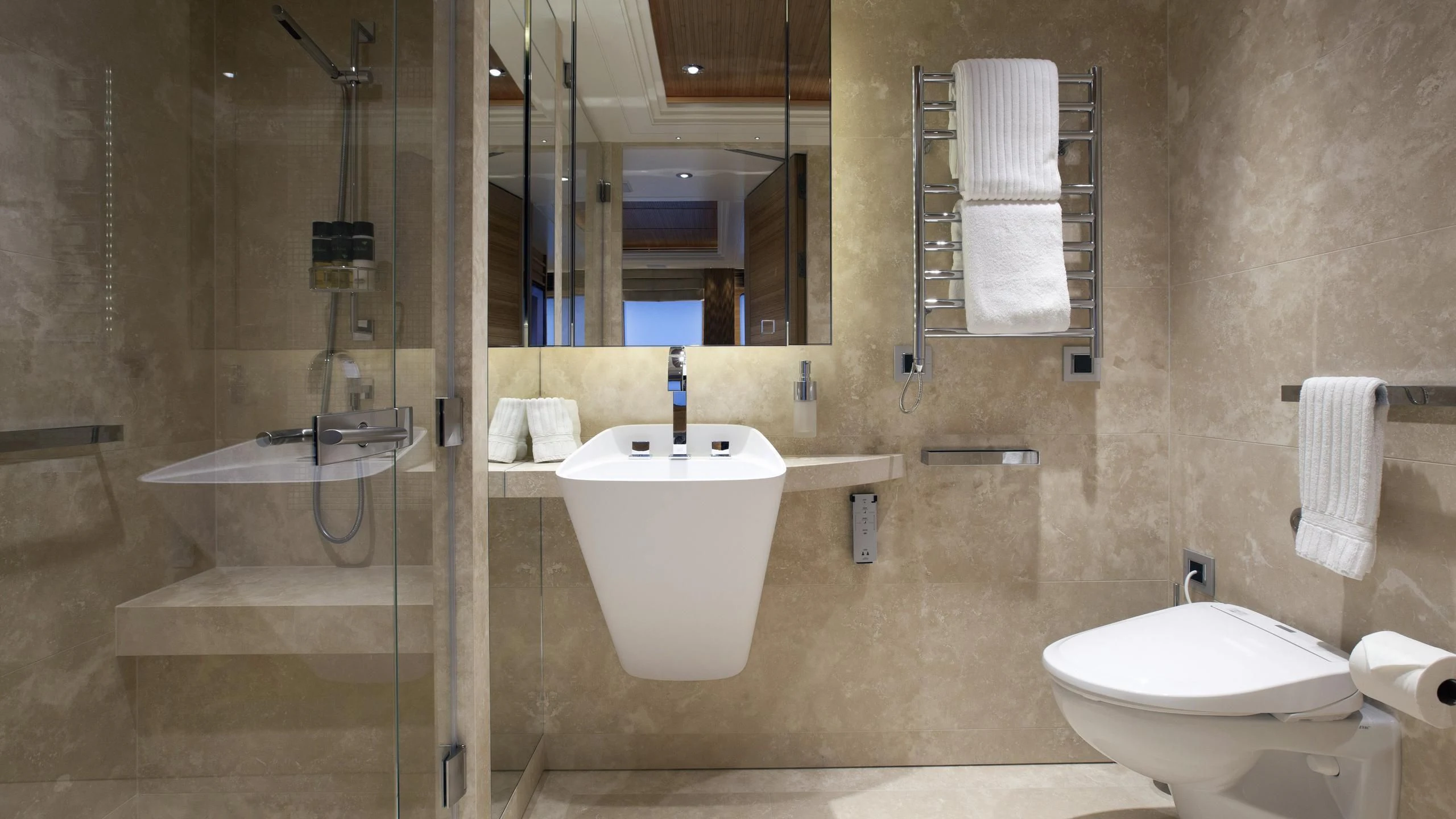 a bathroom with a tub sink and toilet aboard NAIA Yacht for Sale