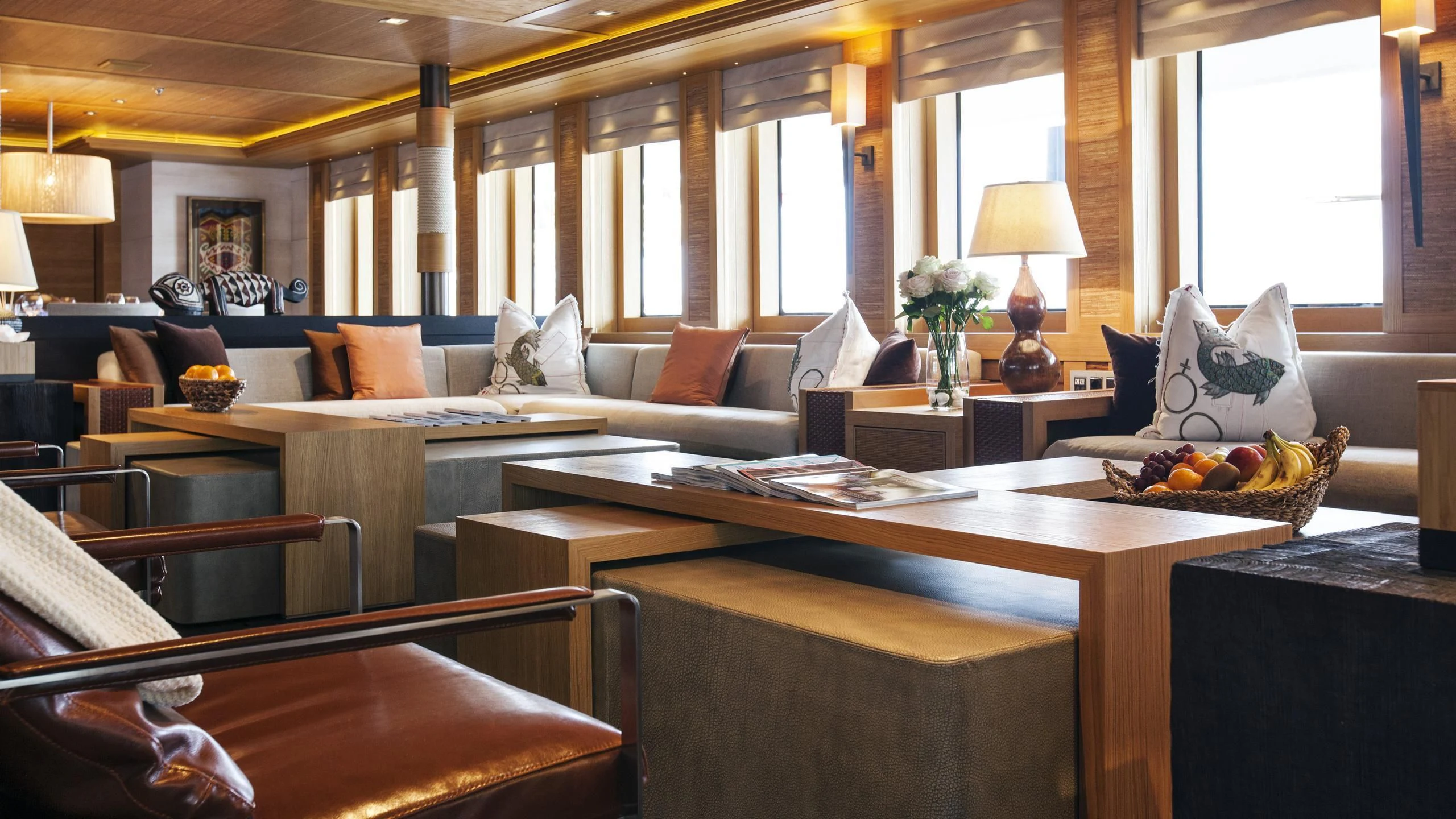 a living room with a couch and a table aboard NAIA Yacht for Sale