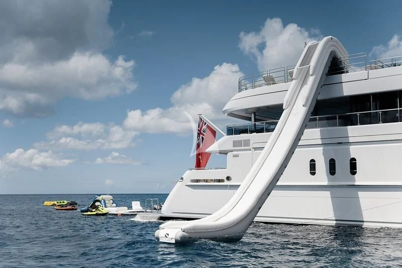 a large white boat in the water aboard NAIA Yacht for Sale
