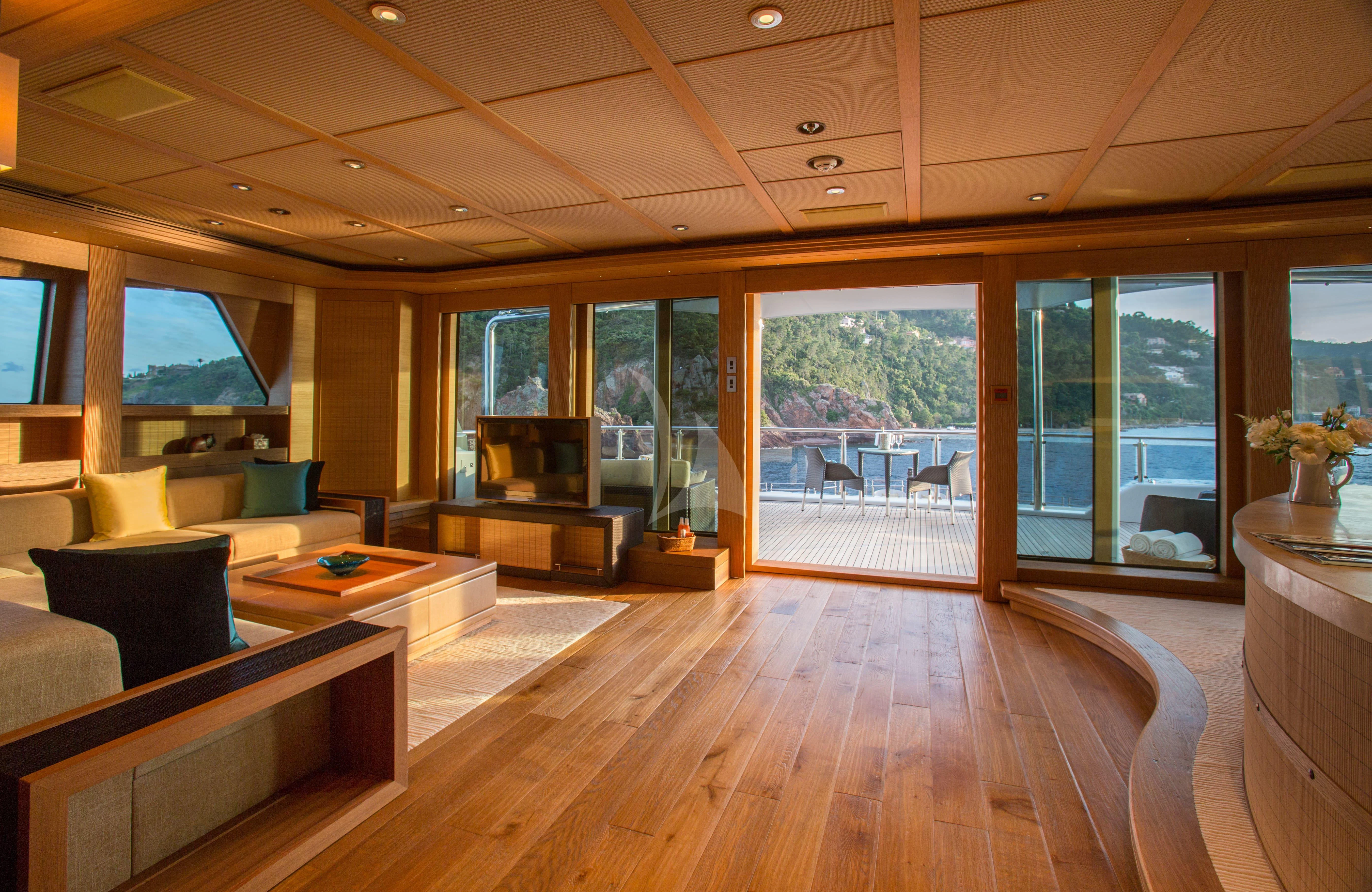 a living room with a large window aboard NAIA Yacht for Sale