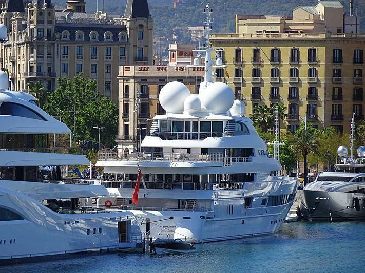 a large white boat in the water aboard NAIA Yacht for Sale