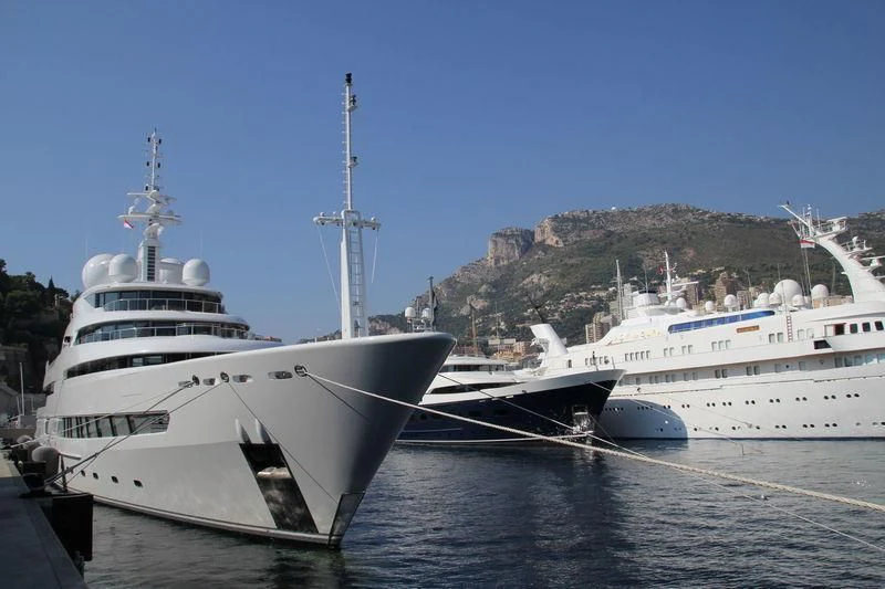 a couple of large white boats aboard NAIA Yacht for Sale