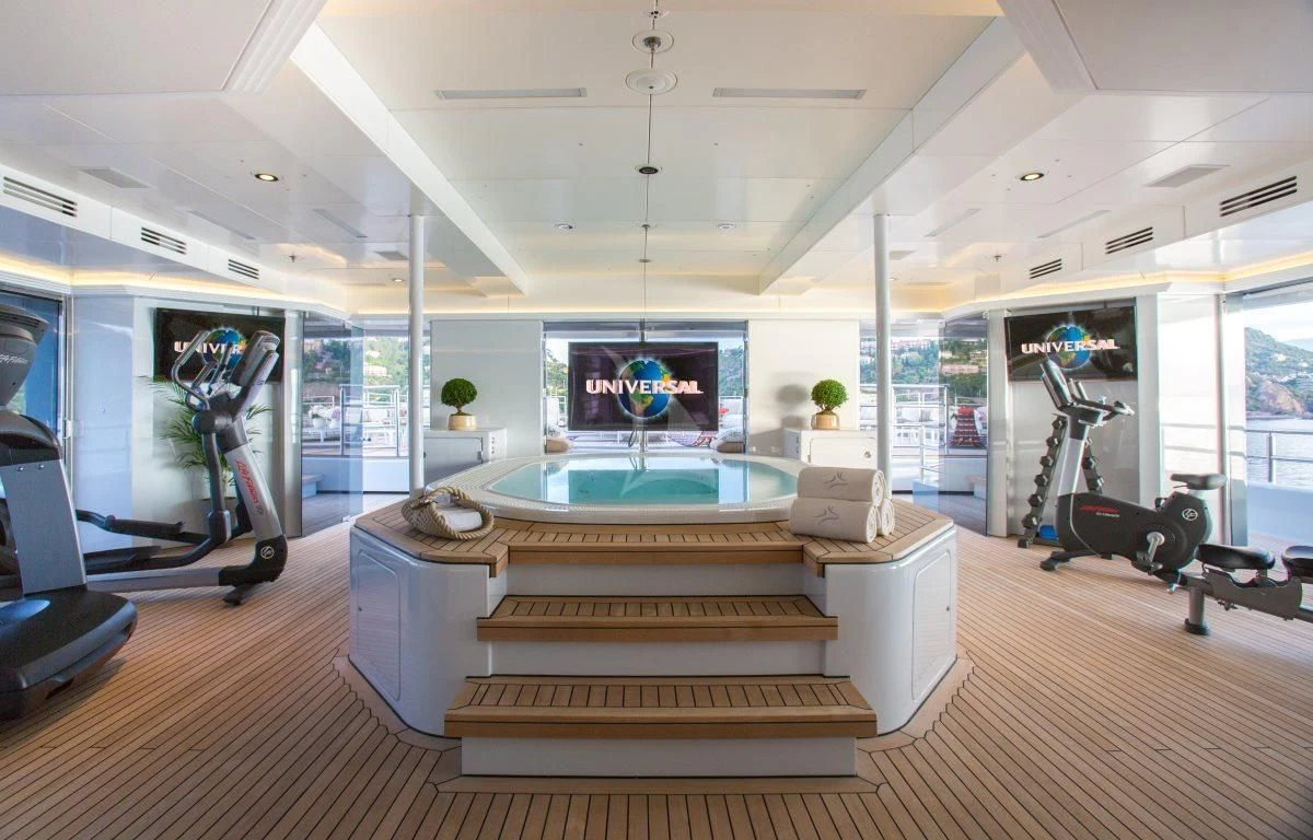 a room with a large indoor pool aboard NAIA Yacht for Sale