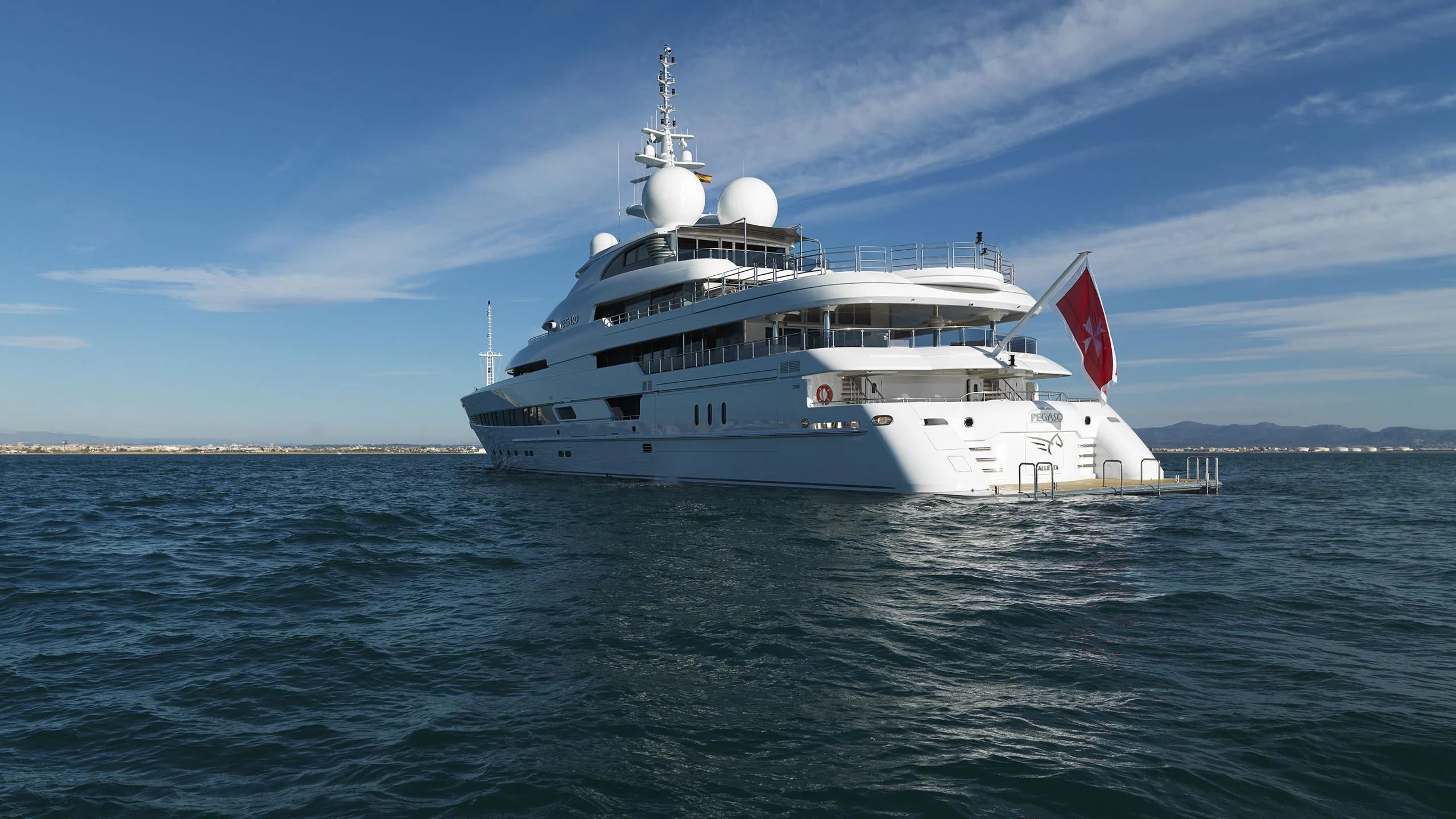 a large white boat in the water aboard NAIA Yacht for Sale