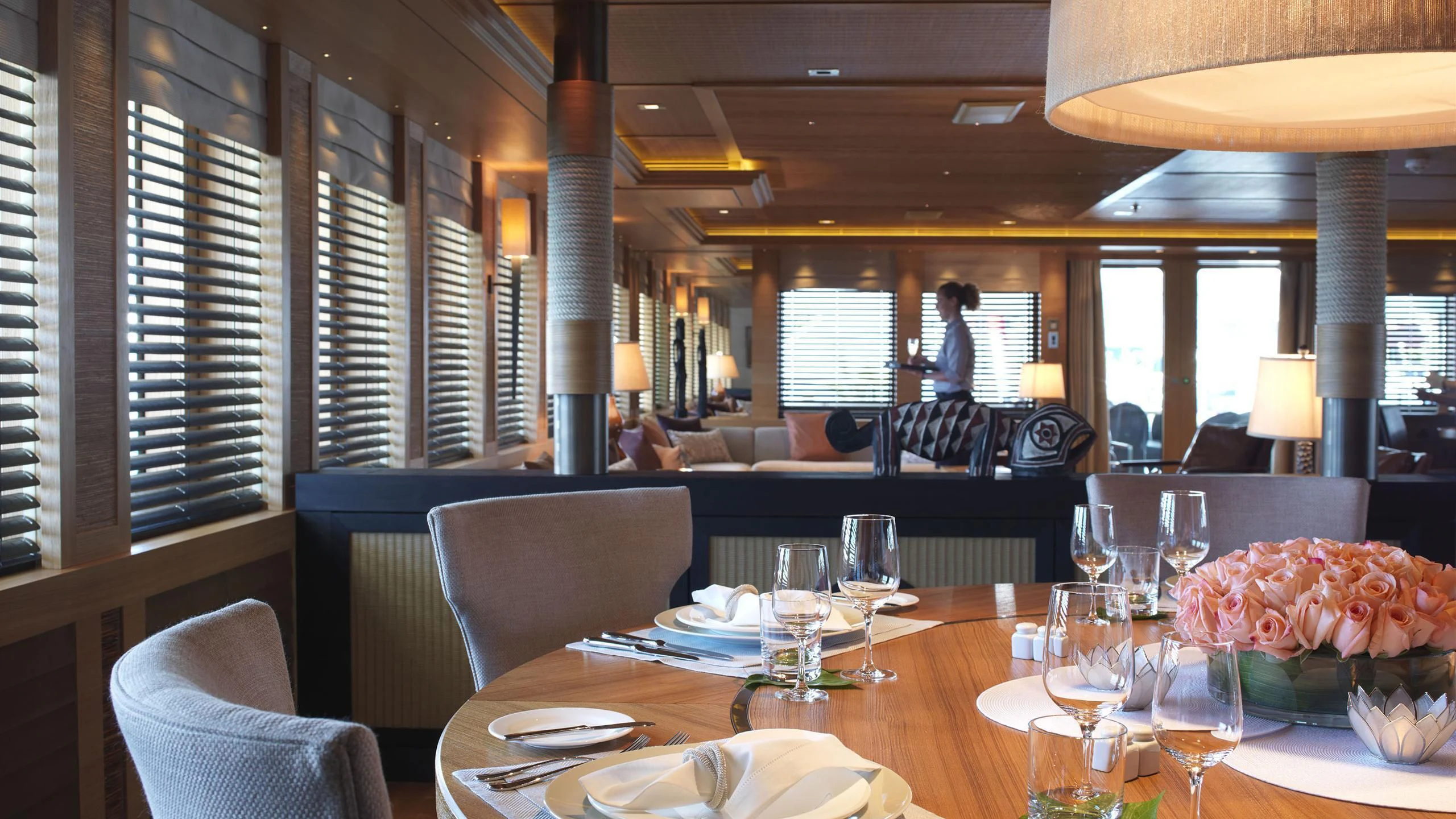 a large dining room table aboard NAIA Yacht for Sale
