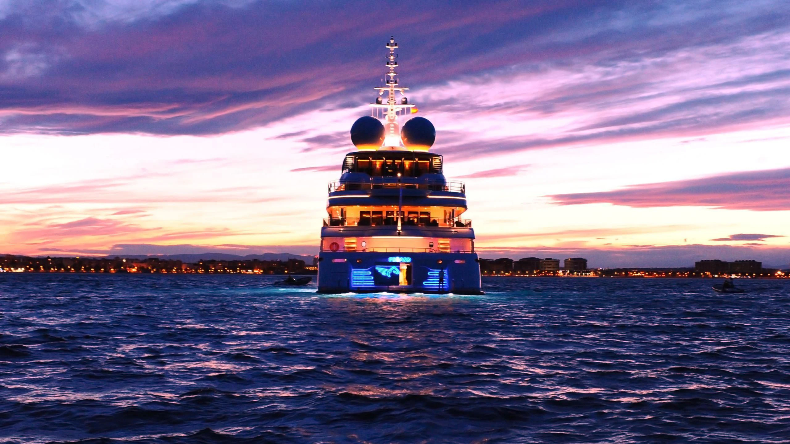 a boat in the water with Maiden's Tower in the background aboard NAIA Yacht for Sale