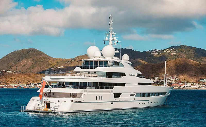 a white yacht in the water aboard NAIA Yacht for Sale