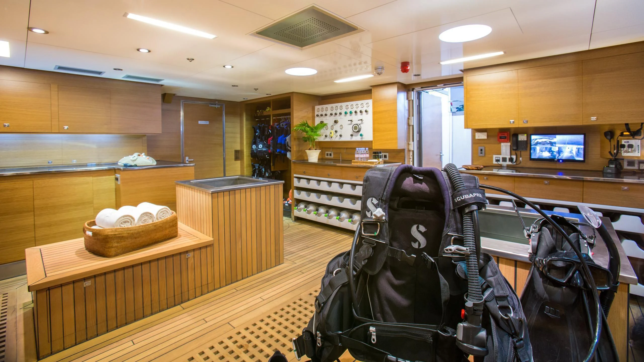 a couple of luggage sits on a table aboard NAIA Yacht for Sale