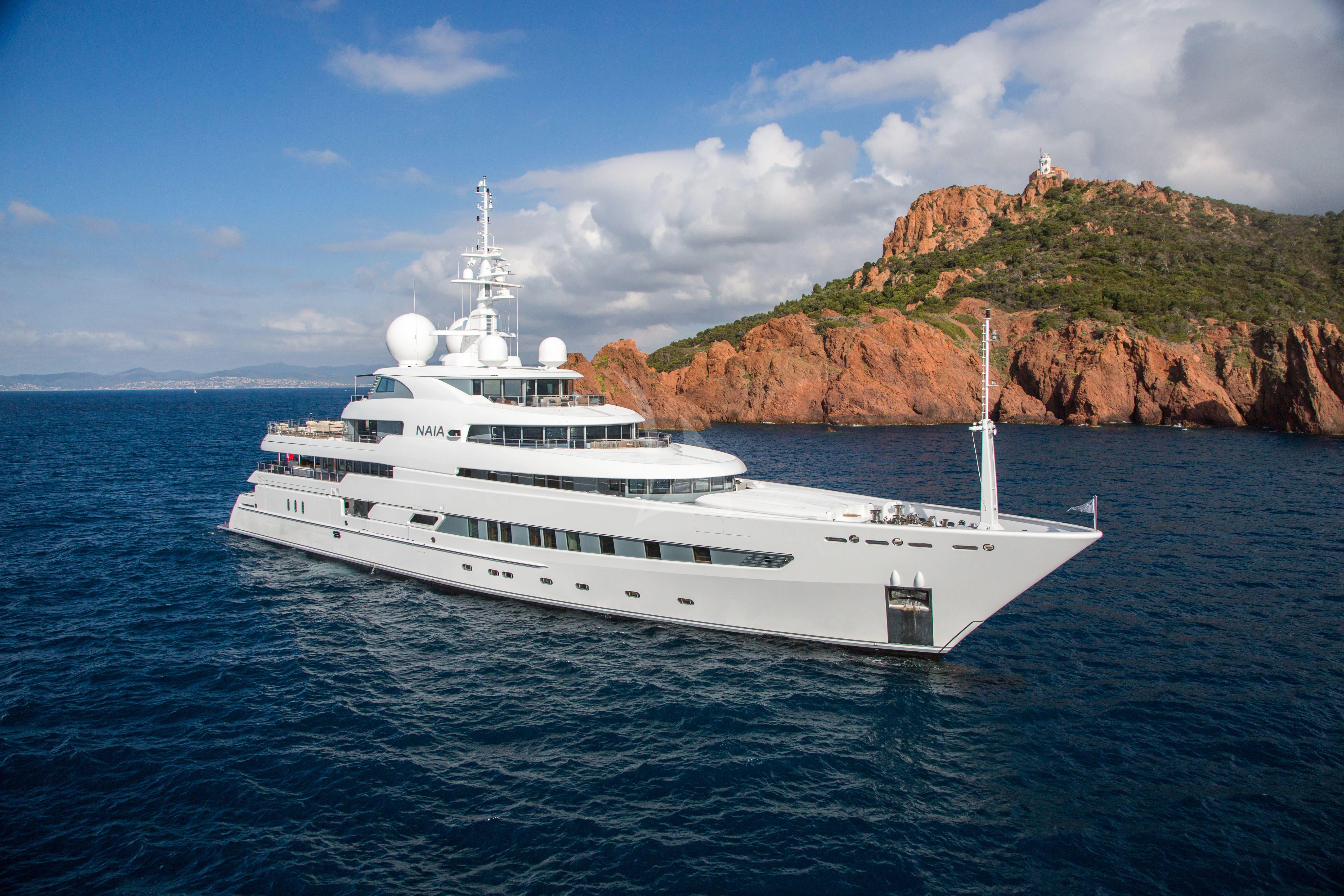 a white yacht in the water aboard NAIA Yacht for Sale