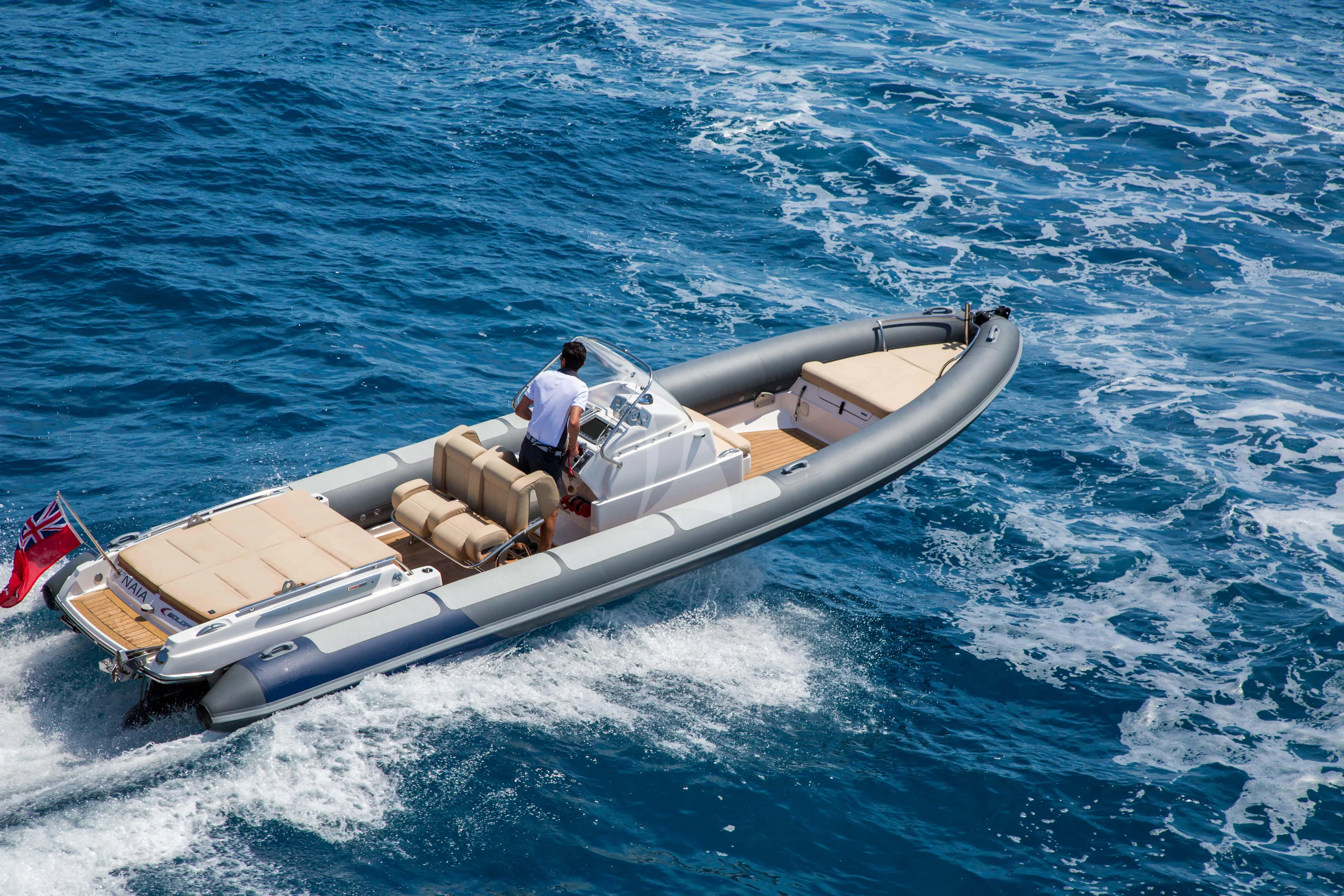 a person in a speedboat aboard NAIA Yacht for Sale