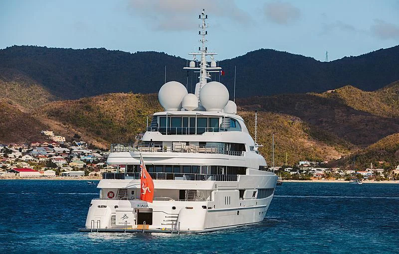 a large white boat on the water aboard NAIA Yacht for Sale