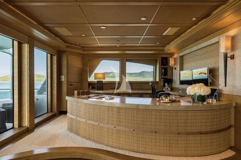 a large room with a large table aboard NAIA Yacht for Sale