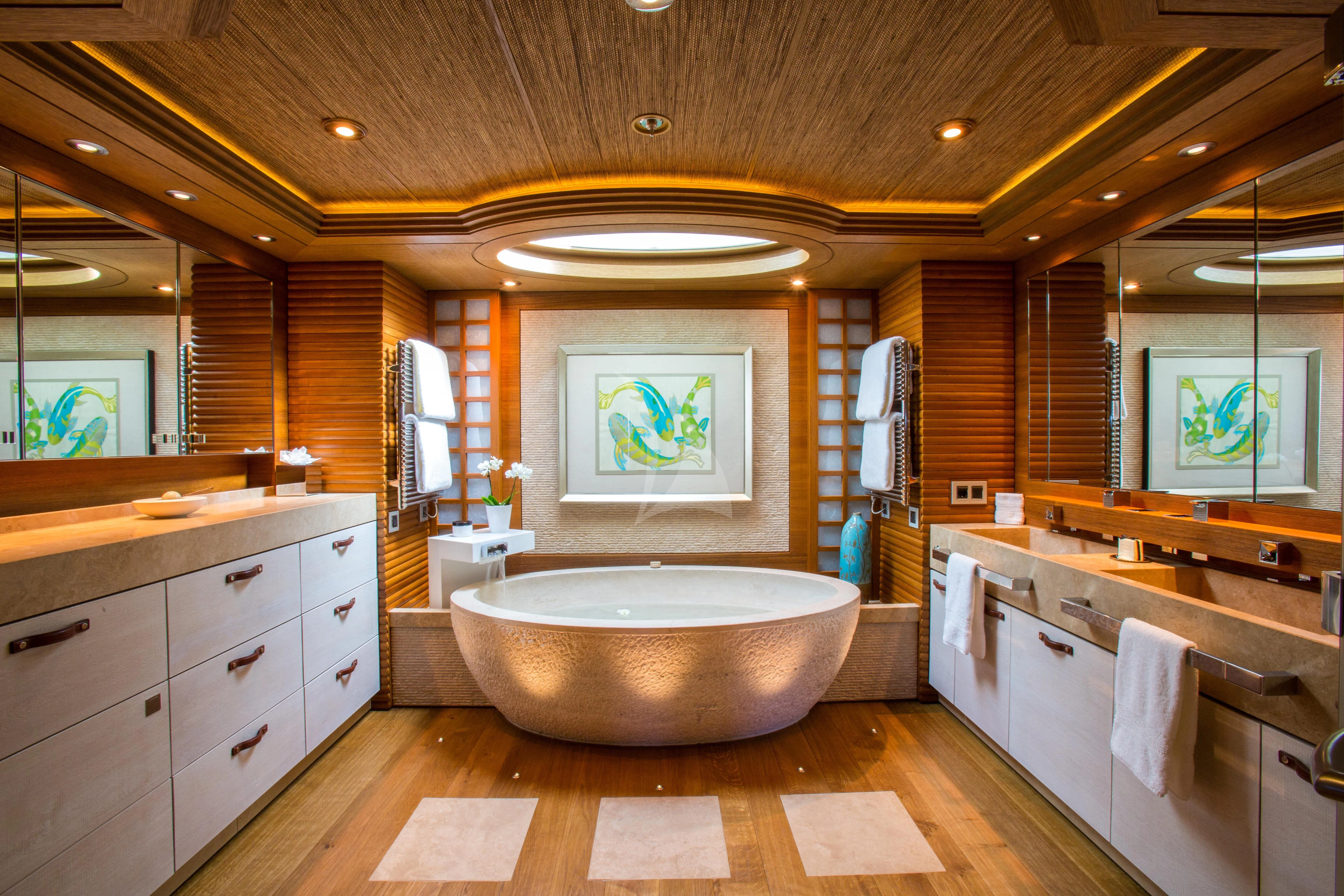 a bathroom with a large bathtub aboard NAIA Yacht for Sale