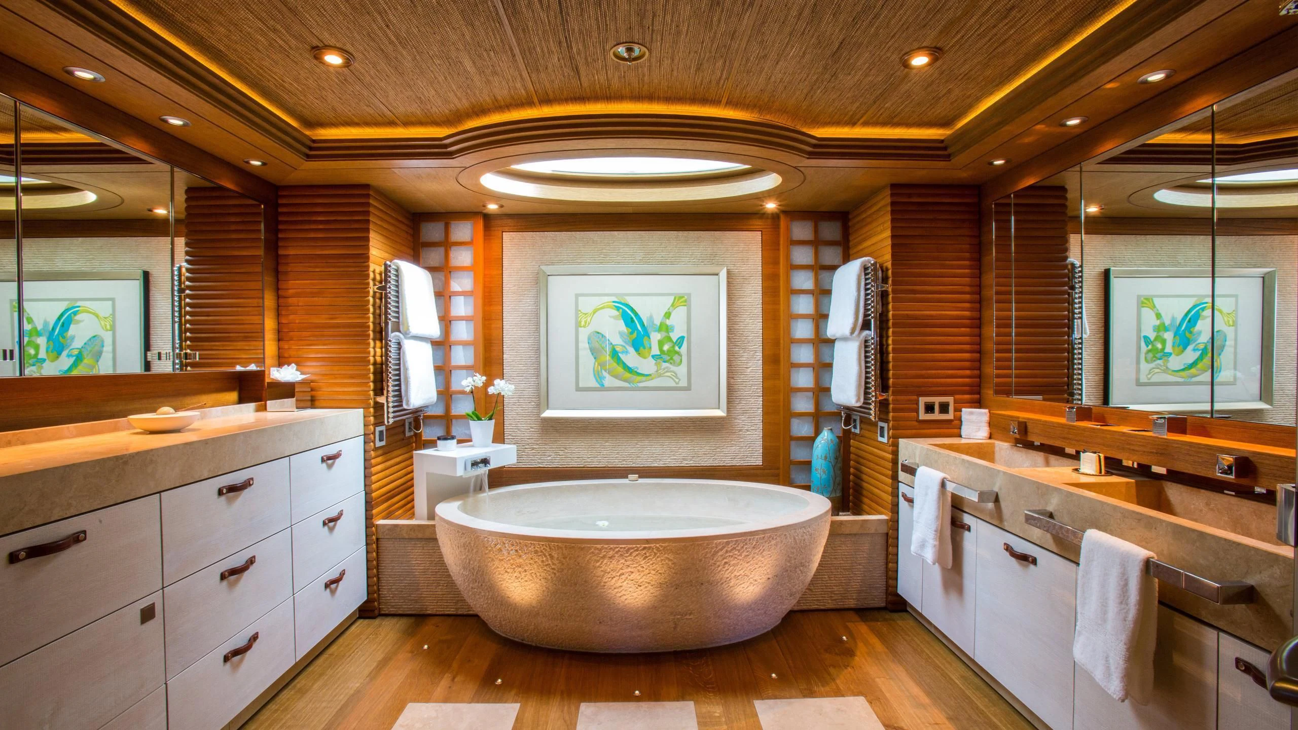 a bathroom with a large bathtub aboard NAIA Yacht for Sale