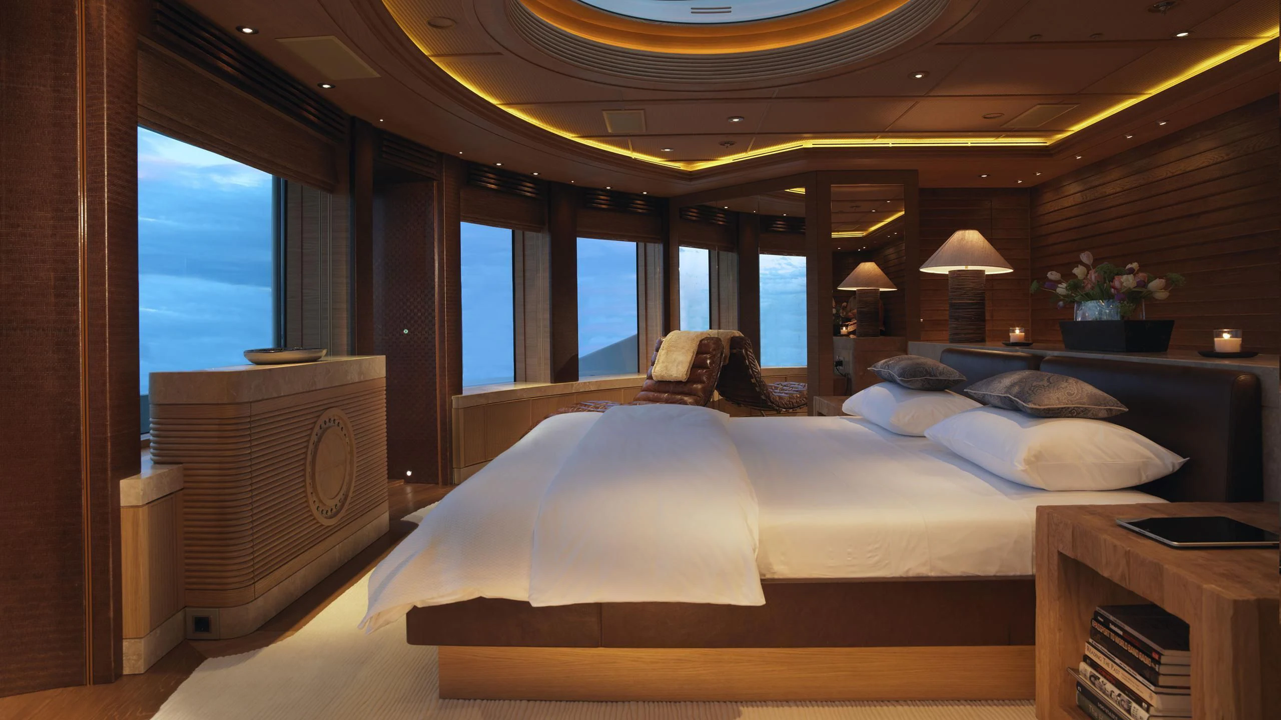 a room with a bed and a window aboard NAIA Yacht for Sale