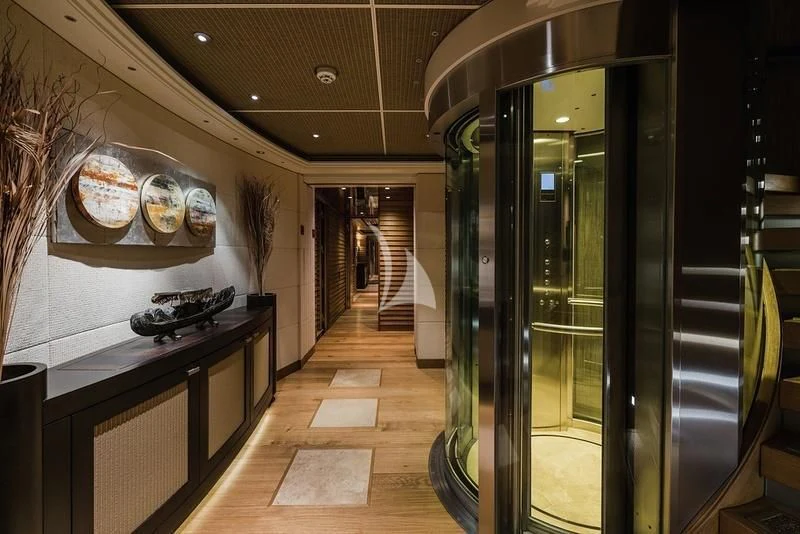 a large kitchen with glass doors aboard NAIA Yacht for Sale