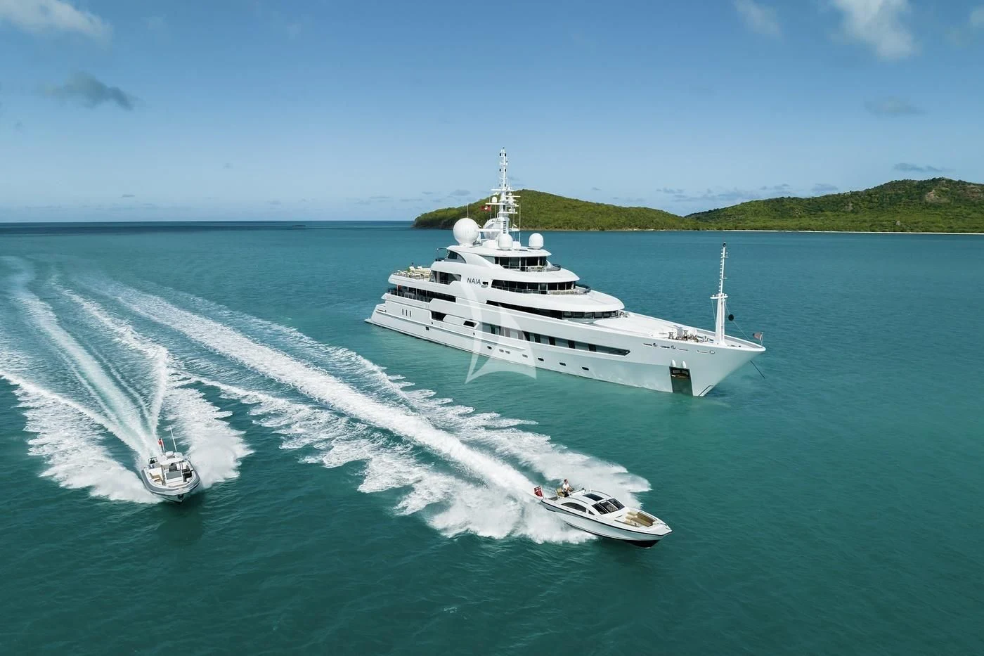 a large ship on the water aboard NAIA Yacht for Sale