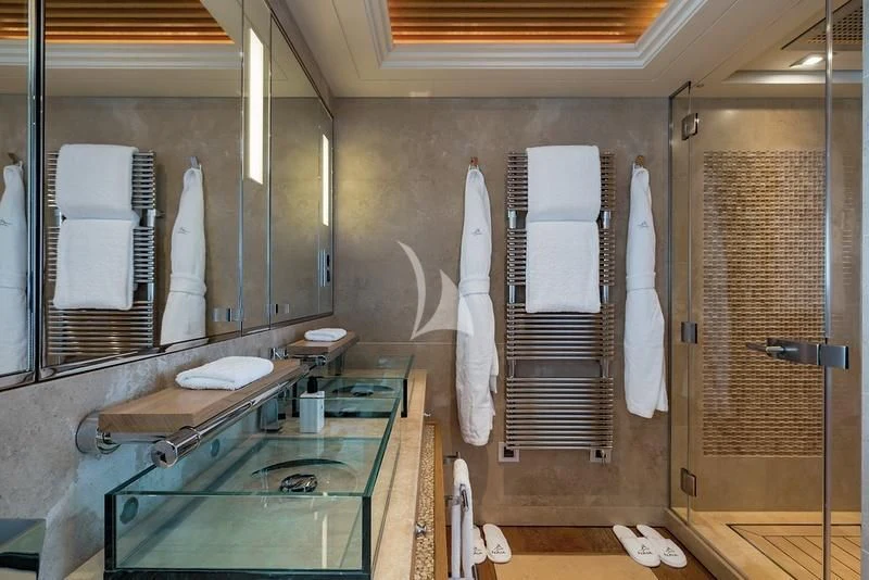 a bathroom with a large mirror aboard NAIA Yacht for Sale