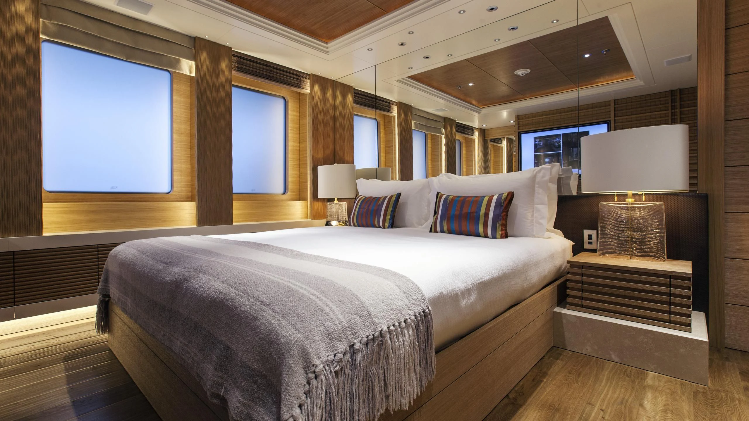 a large bed in a room aboard NAIA Yacht for Sale