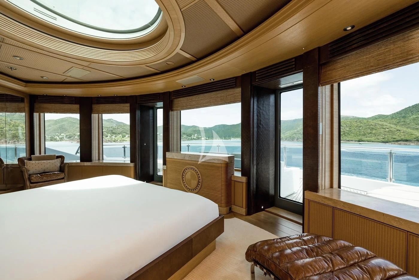 a room with a bed and a window aboard NAIA Yacht for Sale
