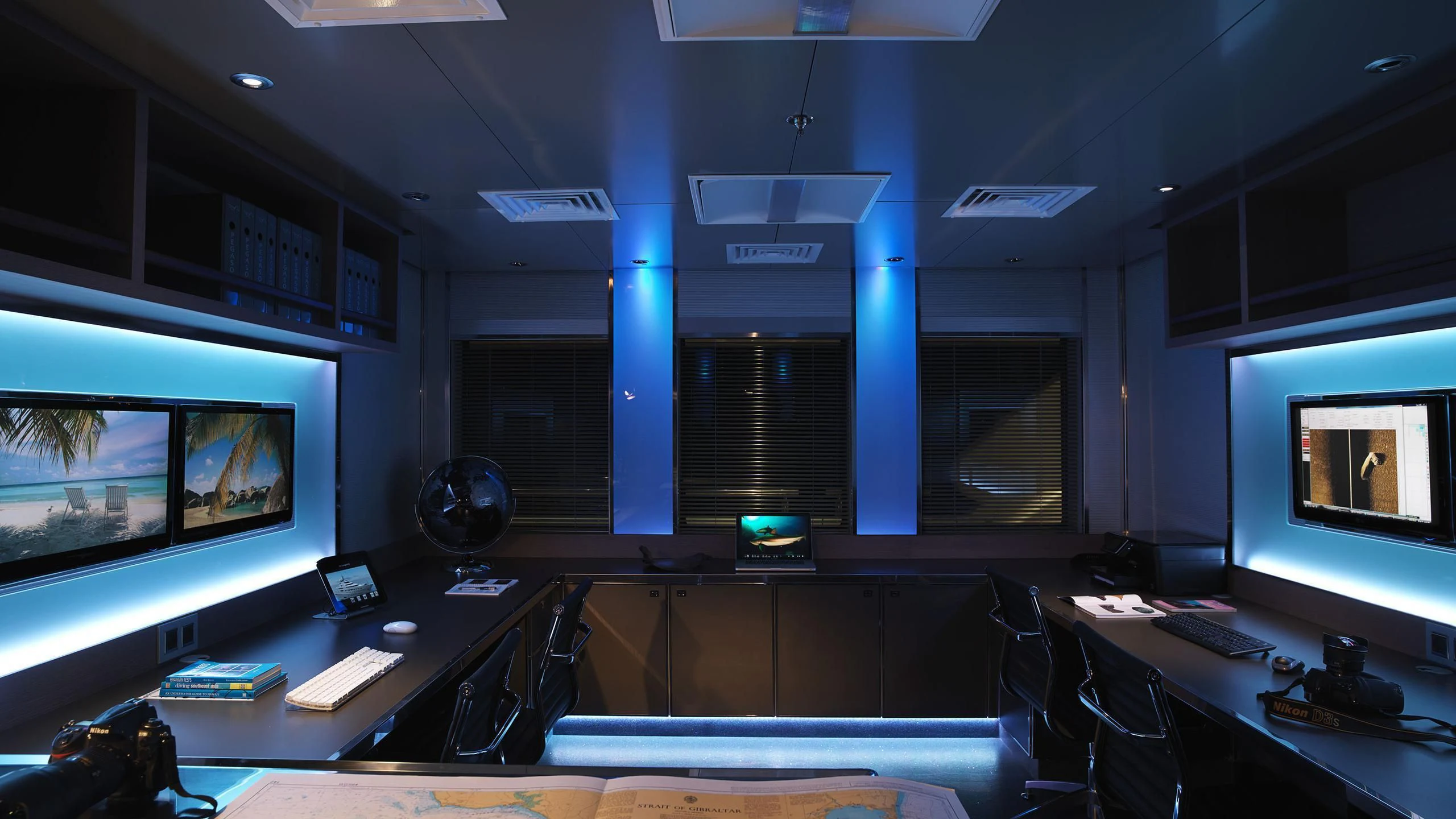 a room with several screens aboard NAIA Yacht for Sale