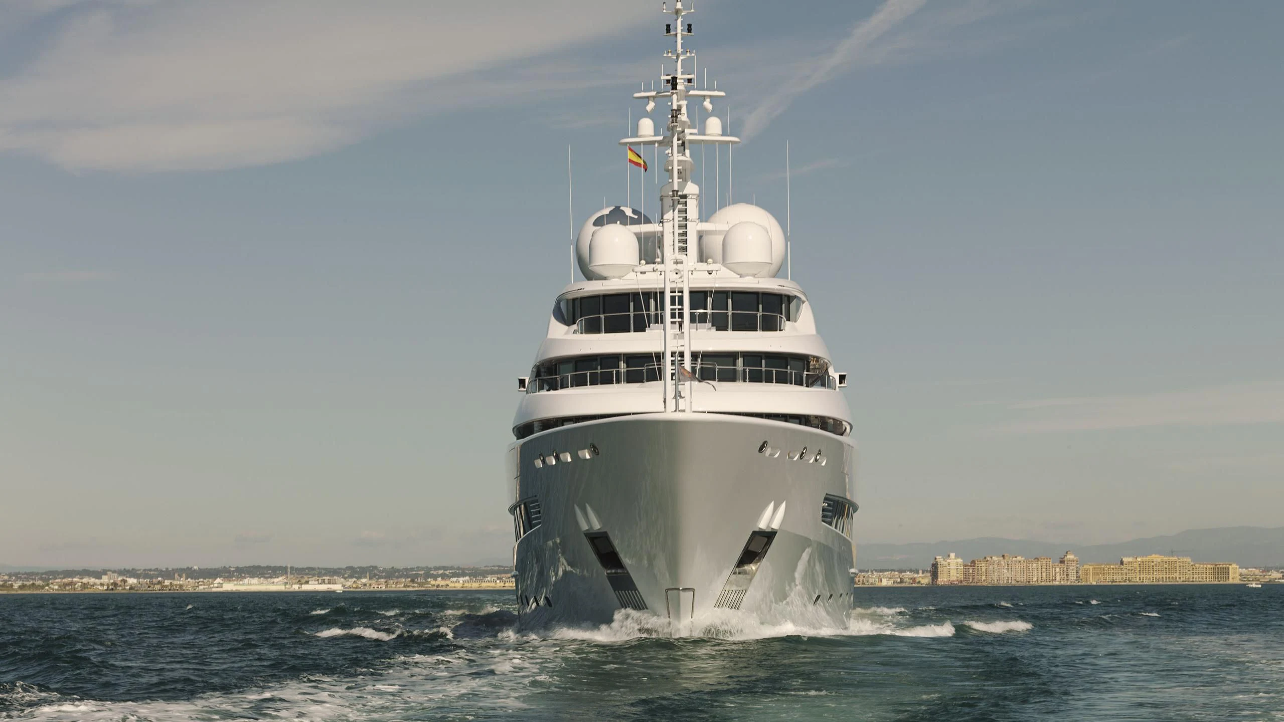 a white boat on the water aboard NAIA Yacht for Sale