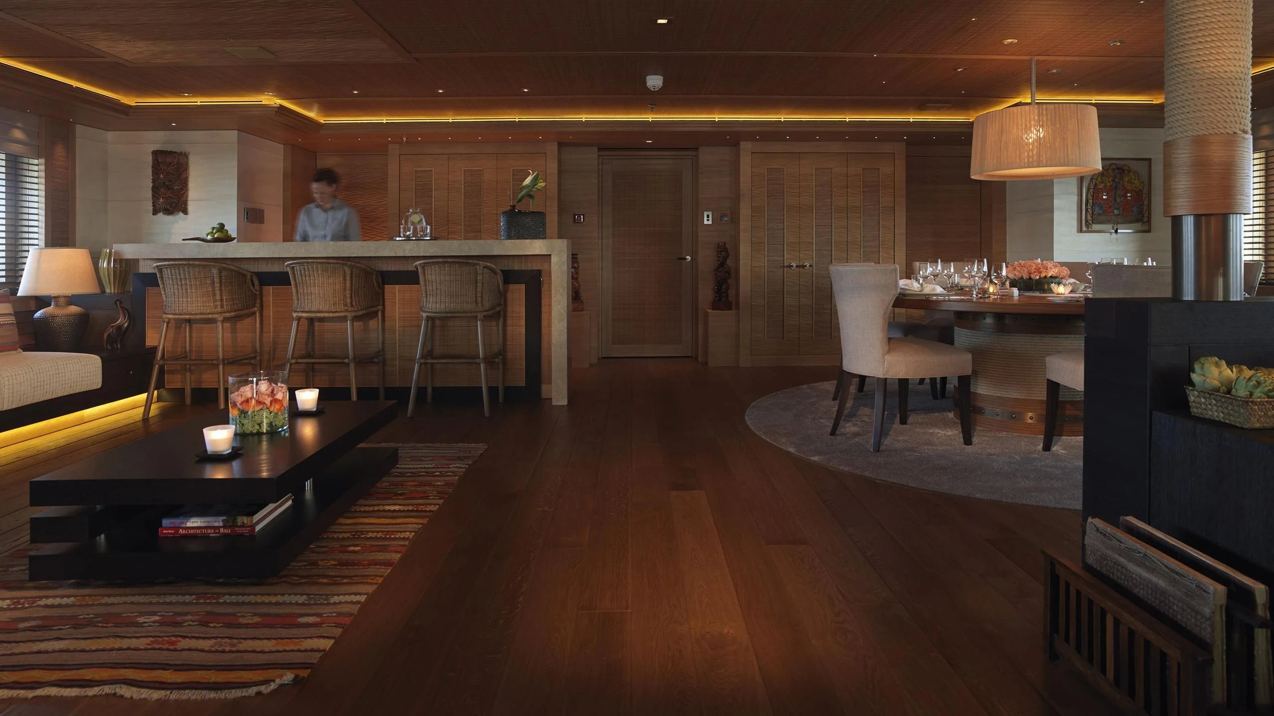 a person sitting at a table aboard NAIA Yacht for Sale