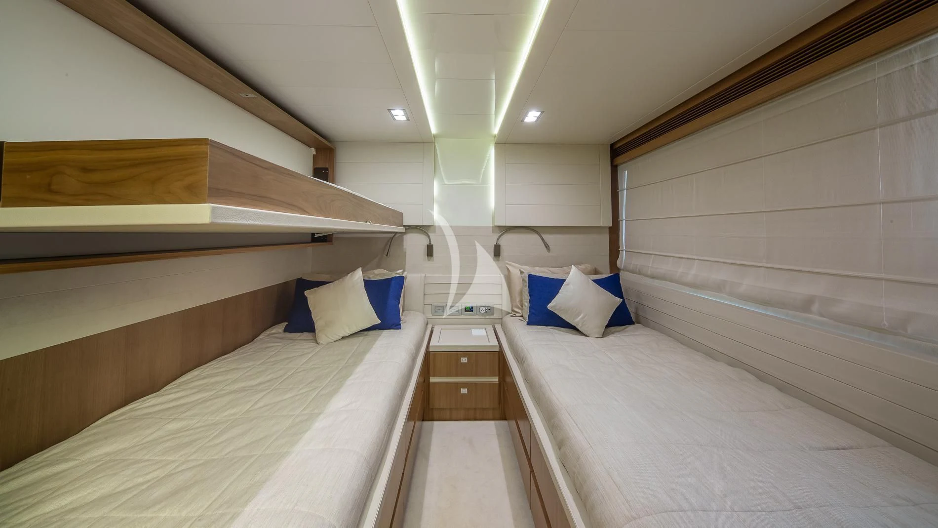 a room with beds and a wood shelf aboard ONE AND ONLY Yacht for Sale