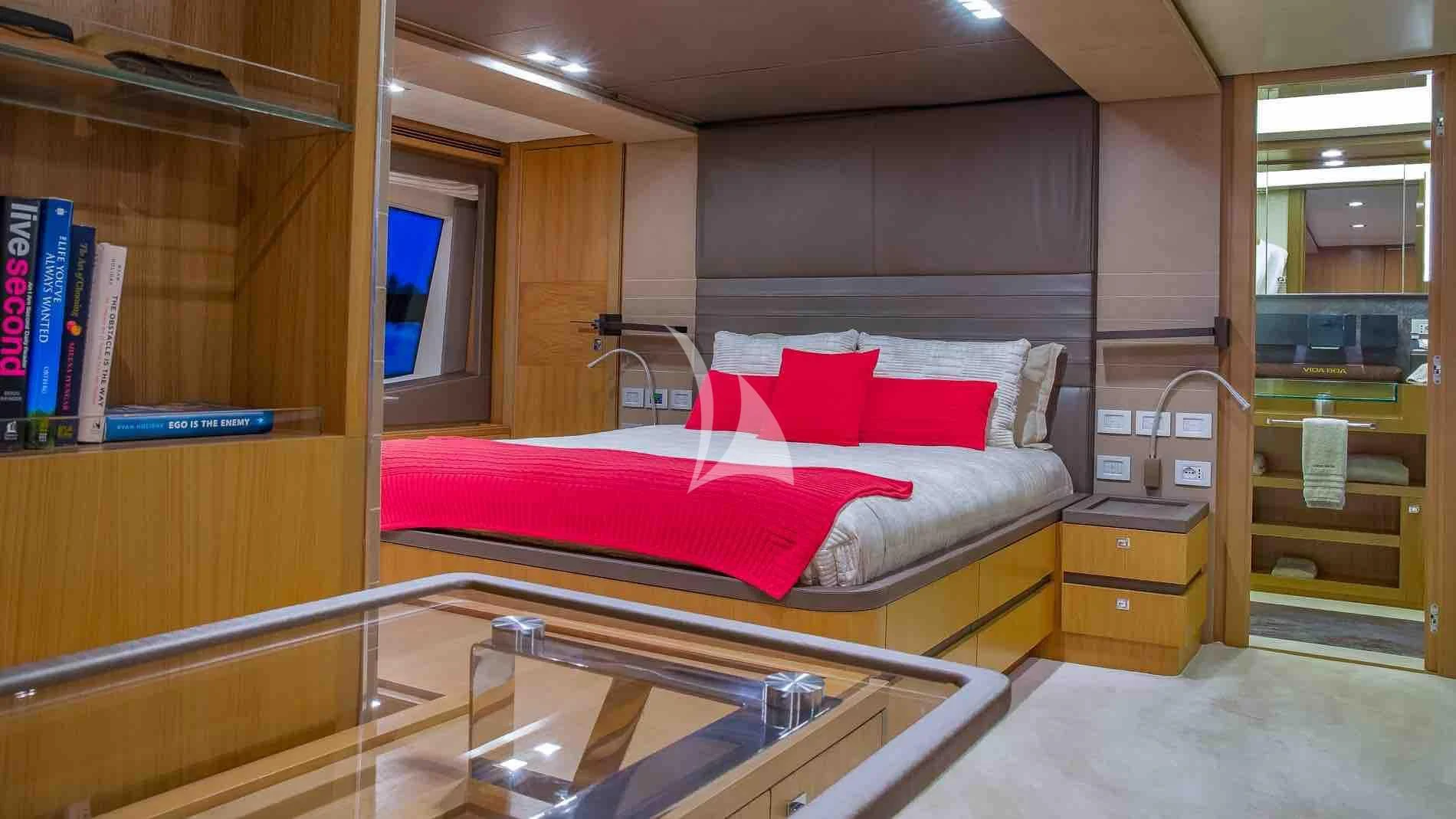 a bed in a room aboard ONE AND ONLY Yacht for Sale