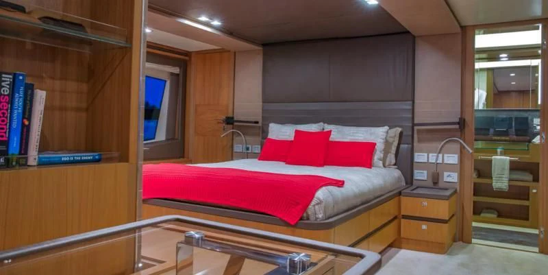 a bed in a room aboard ONE AND ONLY Yacht for Sale