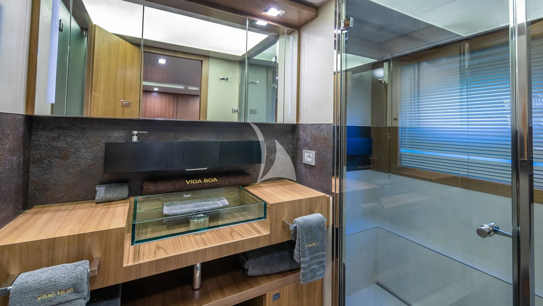 a bathroom with a large mirror aboard ONE AND ONLY Yacht for Sale