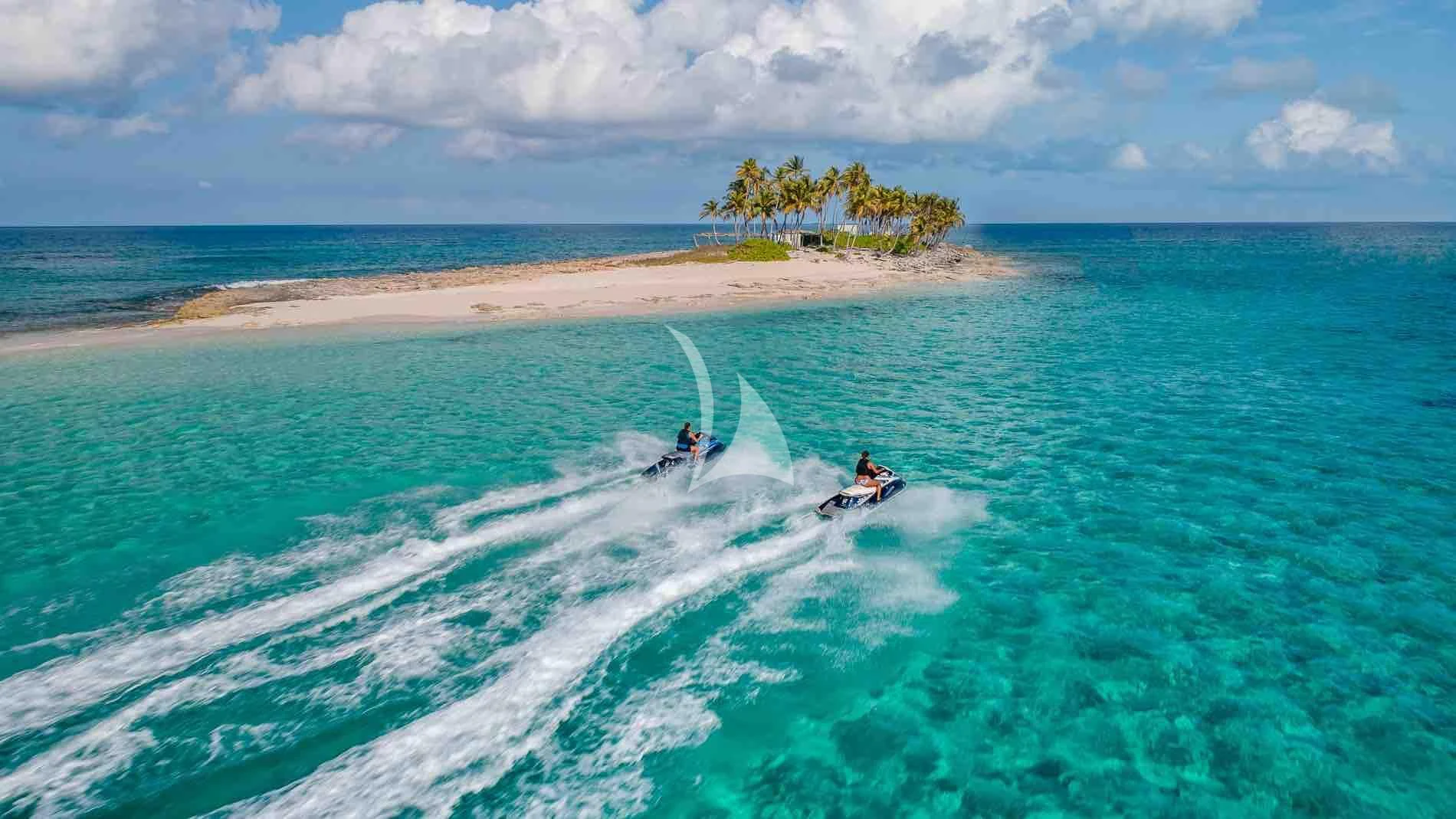 a couple of people in a jet ski on the ocean aboard ONE AND ONLY Yacht for Sale