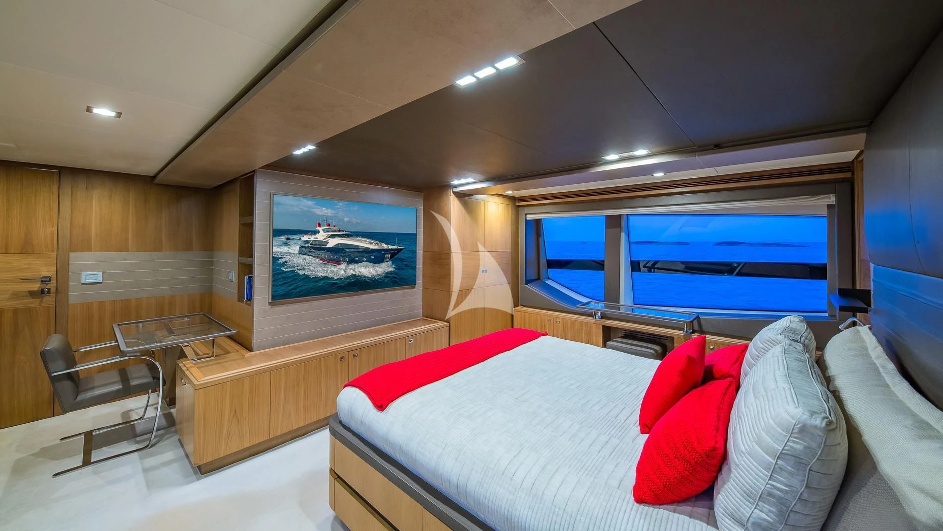 a room with a bed and a tv aboard ONE AND ONLY Yacht for Sale