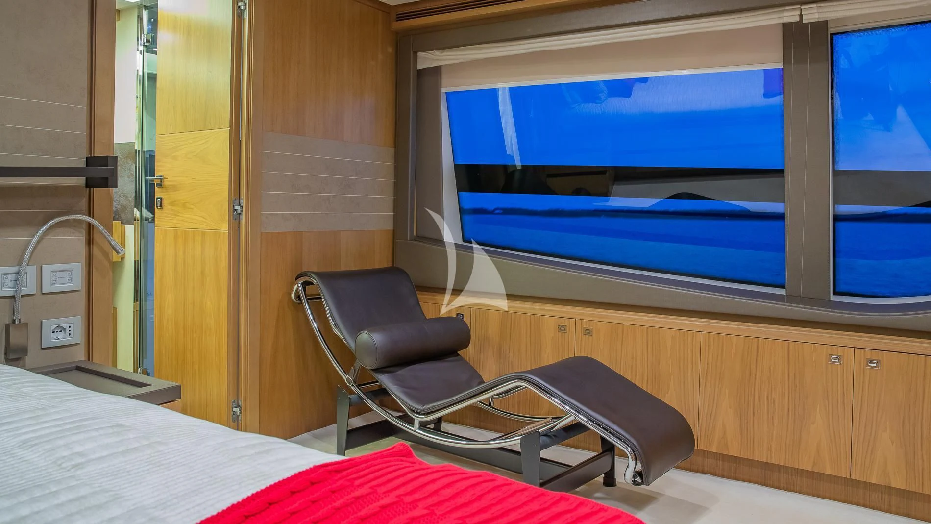 a room with a bed and a tv aboard ONE AND ONLY Yacht for Sale
